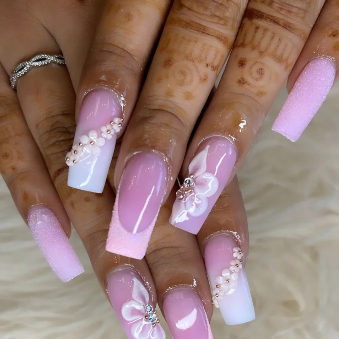 Pink and white coffin nails with sugar texture and floral details by Your Way Nail Spa